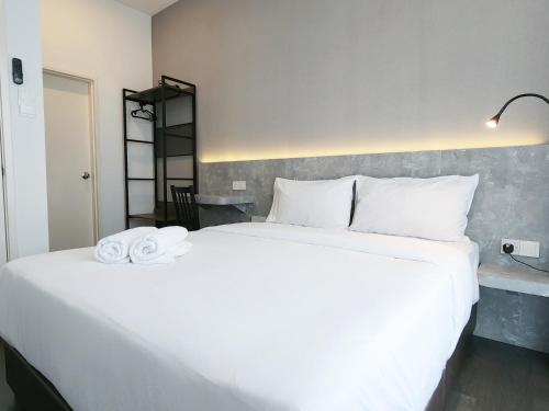 Ένα ή περισσότερα κρεβάτια σε δωμάτιο στο SKS Pavillion Suites