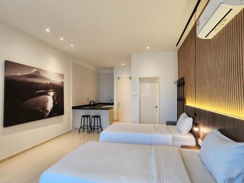 Ένα ή περισσότερα κρεβάτια σε δωμάτιο στο SKS Pavillion Suites