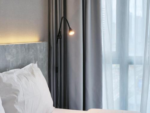 Ένα ή περισσότερα κρεβάτια σε δωμάτιο στο SKS Pavillion Suites