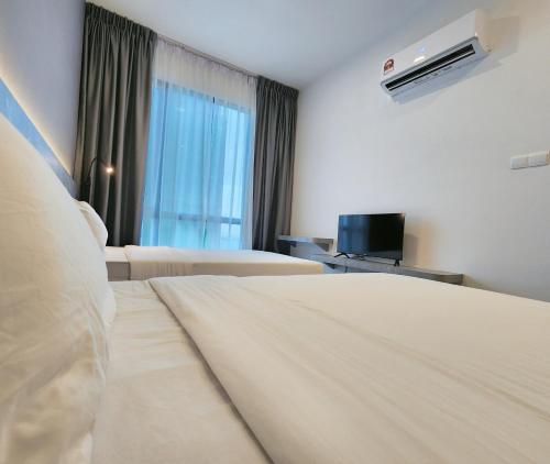 Ένα ή περισσότερα κρεβάτια σε δωμάτιο στο SKS Pavillion Suites