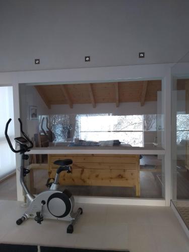 a room with a desk with a chair in it at Haus am Teich mit privater Sauna in Sankt Leonhard bei Freistadt