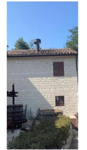 a building with a cross on the side of it at Villa Boccolini Appartamento in Sirolo