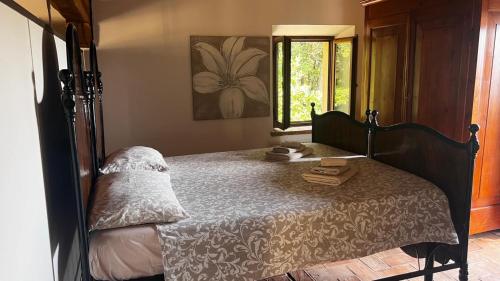 a bedroom with a bed with a mirror on it at Villa Boccolini Appartamento in Sirolo