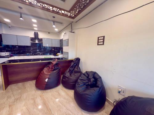 two bean bags in a room with a kitchen at POCOYO - BACKPACKERS HOSTEL - Omr in Chennai