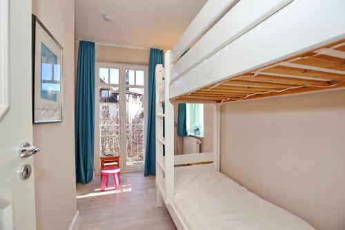 Ένα ή περισσότερα κρεβάτια σε δωμάτιο στο Villa Seepferdchen Wohnung 05