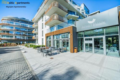 an empty parking lot in front of a building at Baltic Apartments - Albus in Świnoujście