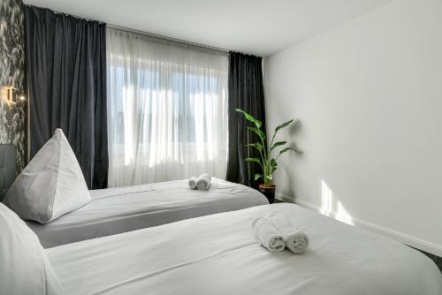 Ένα ή περισσότερα κρεβάτια σε δωμάτιο στο George Apartment