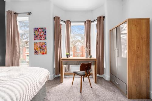 a bedroom with a desk and a bed and a desk and a chair at Stylish Interior Designed Home in Crewe