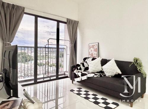 a living room with a couch and a large window at C180 Trader Park 3BR Family Suite #20 in Cheras