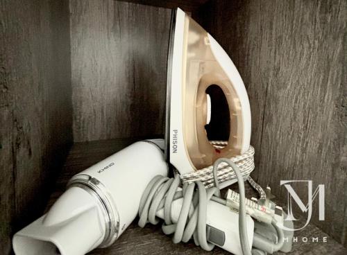 a white telescope in a corner of a wall at C180 Trader Park 3BR Family Suite #20 in Cheras