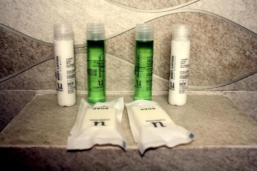 a group of four thermometers sitting on a counter at The Magic Sponge in Kampot