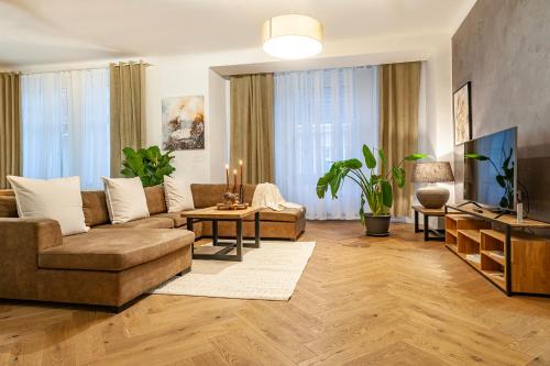 a living room with a couch and a table at Sting Old Town Ostrava in Ostrava