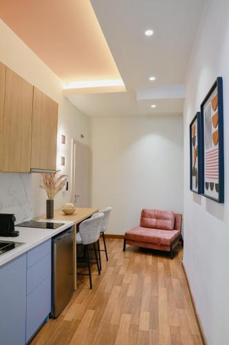 a kitchen with a counter and a table and chairs at Ciao Xanthi Central Square Studio in Xanthi