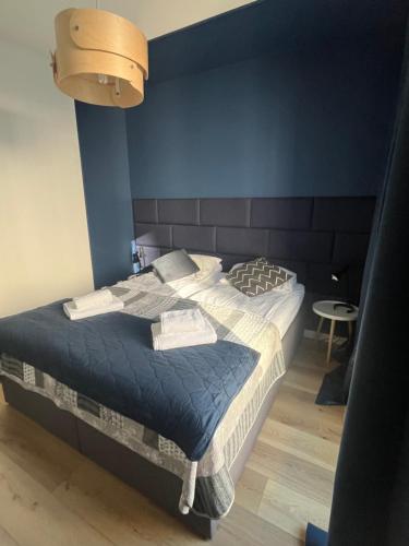 Posteľ alebo postele v izbe v ubytovaní AL-DOM apartamenty Kniewskiego 11 Kolobrzeg