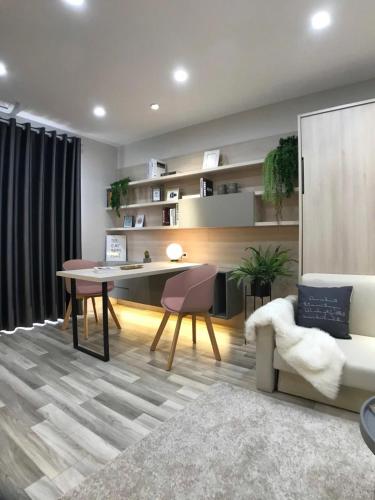 a living room with a table and a couch at HN ETH Vinhomes D'capitale Resident - Tran Duy Hung St in Hanoi