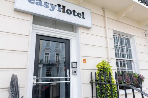 a store front with a sign on the door at easyHotel Victoria in London