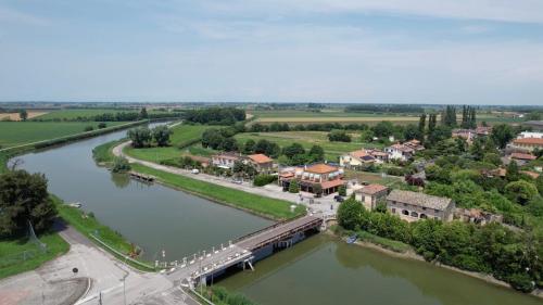 an aerial view of a town next to a river at Le Camere sul Fiume in Boccatossa