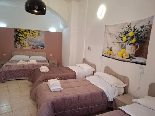 Postel nebo postele na pokoji v ubytování B&B Le Lumìe "Il Cortiletto Del Centro"