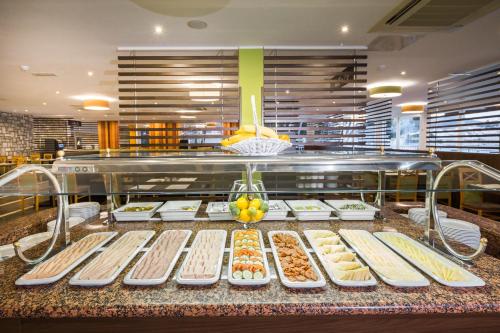 a buffet line with many different types of food at Hotel Zora in Primošten