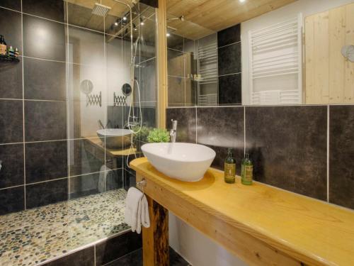 a bathroom with a sink and two sinks in it at Chalet 5★, 15 pers, pied des pistes, spa extérieur, 7 chambres - FR-1-304-308 in La Clusaz