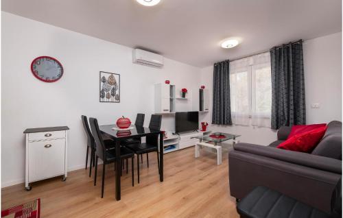 a living room with a table and a dining room at Apartman Porec Center Sea in Poreč