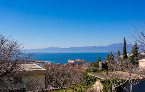 a view of a body of water with trees and buildings at 1 Bedroom Cozy Apartment In Kraljevica in Kraljevica