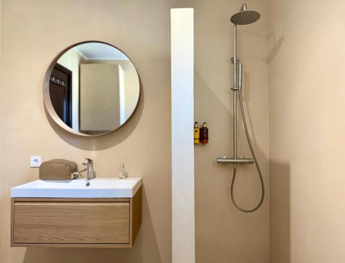 a bathroom with a sink and a mirror at Canaryislandshost I Dalia in Puerto del Carmen