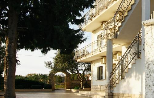 a building with balconies on the side of it at Nice Apartment In Jezera With Wifi in Vrelo Koreničko