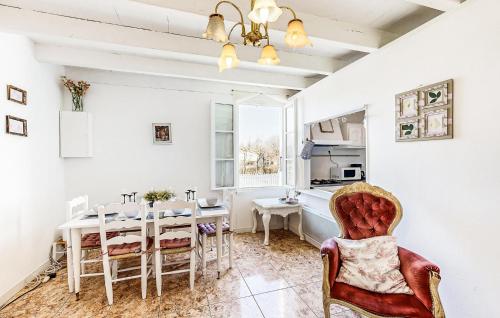 a dining room with a table and chairs at 2 Bedroom Cozy Home In Oradour-Fanais in Oradour-Fanais