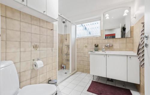 a bathroom with a toilet and a sink and a shower at Beautiful Home In Viby Sjælland in Dåstrup