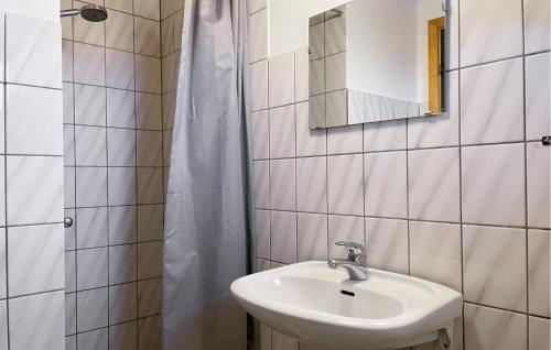 a bathroom with a sink and a mirror at 3 Bedroom Gorgeous Home In Hesselager in Hesselager