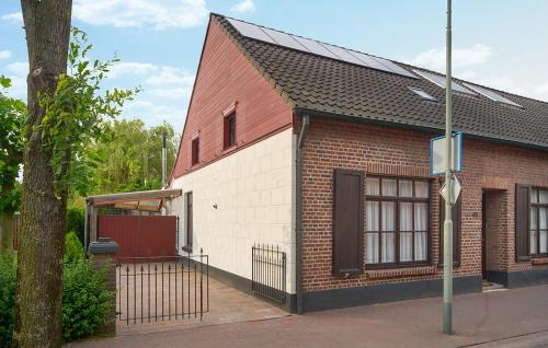 a small brick building with a red roof at Pet Friendly Home In Ospel With Wifi in Ospel