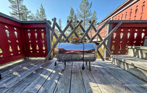 a suitcase is sitting on a wooden deck at Beautiful Home In Jordet With Sauna in Jordet