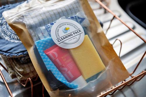 a bag of cleaning picks sitting on a rack at Finest Retreats - The Stables at Crimplesham in Stradsett