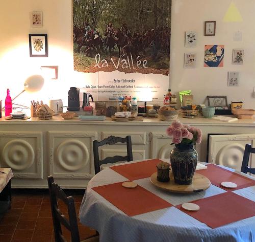 a table with a vase on top of a table at Domaine Le Berdoy in Montesquiou