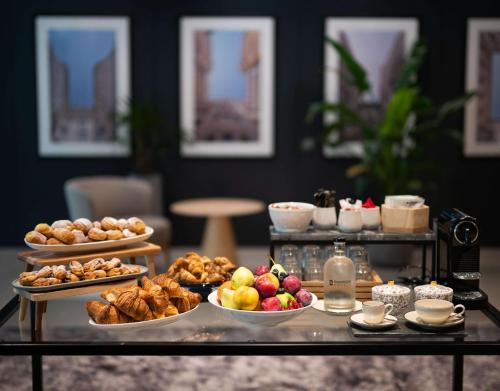 a table topped with lots of different types of food at Radisson Hotel Budapest BudaPart in Budapest