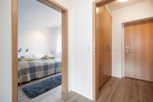 a bedroom with a bed and a large mirror at Reykjavík Central Apartments in Reykjavík