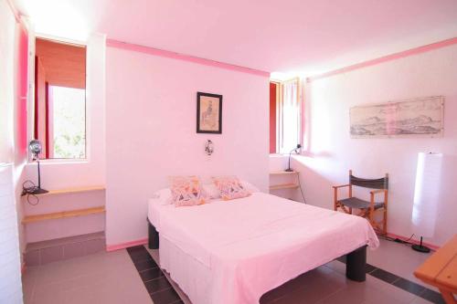 a bedroom with a bed and a chair in it at Apartment with beautiful views - Muralla0218 in Calpe