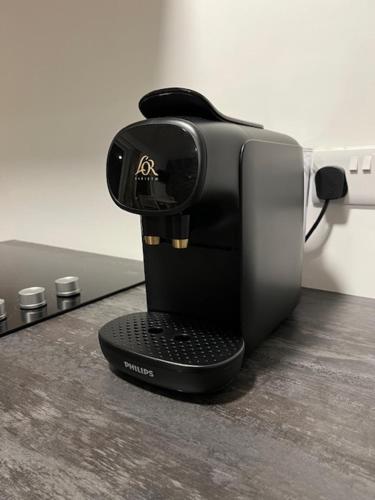 a coffee maker sitting on top of a table at Cille Apartments, Ballyferriter village in Ballyferriter