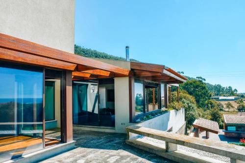 a house with a view of the ocean at Just Like Home - Casa do Caracol Horizon Retreat in Viana do Castelo