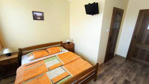 a bedroom with a large bed with a map at Jaś i Małgosia nad Jeziorem Wigry in Rosochaty Róg