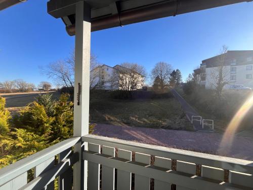 a view from the porch of a house with a white fence at Ferienwohnung Nummer 17 in Bad Rodach