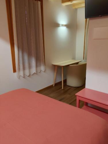 Una cama o camas en una habitación de Agriturismo La Collina delle Api