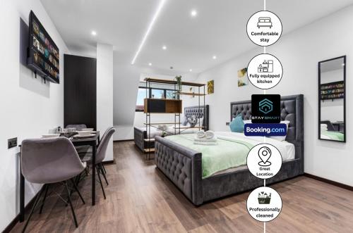 a bedroom with a bed and a desk and a dining room at Stylish Studio Apt By Stay Smart Short Lets & Serviced Accommodation Golders Green With Free WiFi in London