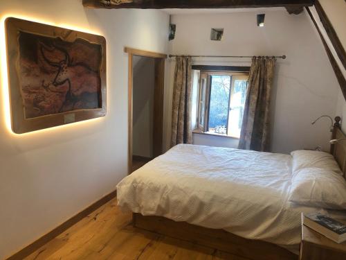 Postel nebo postele na pokoji v ubytování Le Vieux Fournil