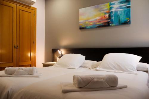 Postel nebo postele na pokoji v ubytování Hotel Tierra de Garnacha
