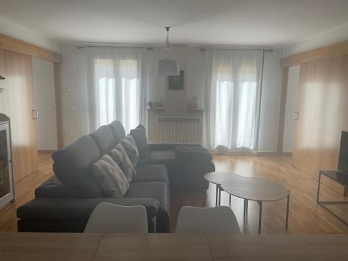 a living room with a couch and a table at El Rincón del Ángel in Jaca