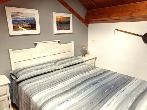 a bedroom with a large bed in a room at L'avet blau in Sainte-Léocadie