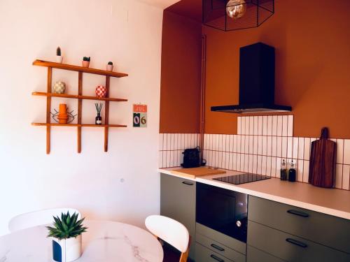 Kuchyň nebo kuchyňský kout v ubytování Appartement Clim Wifi Tendance