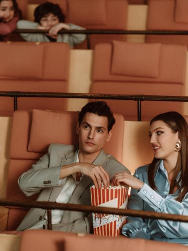a man and a woman sitting in a movie theater at Vana Spa Snäckviken by Elite - A proud member of The Leading Spa Hotels of Sweden in Södertälje